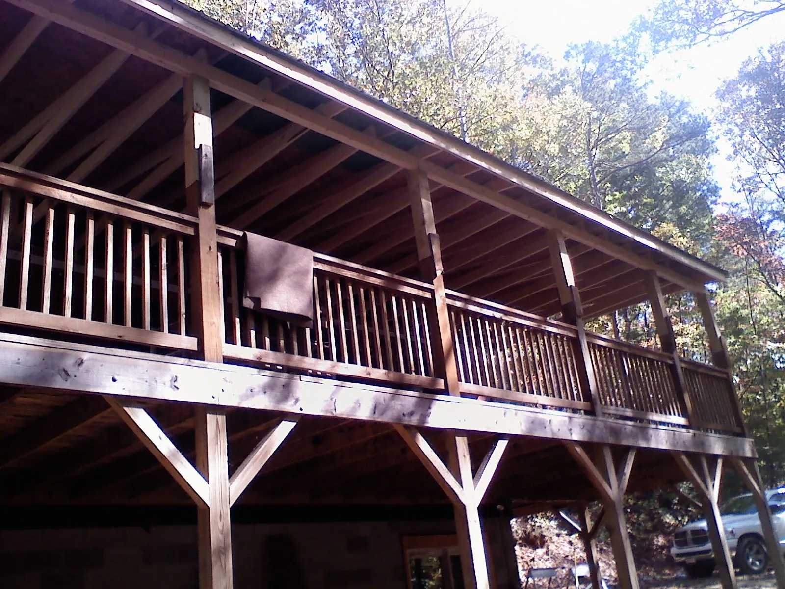 Timber framing under a new elevated porch and deck — Roof Leak Repair in Belfast by Roofing Brothers